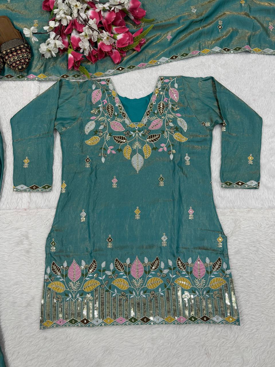 Elegant Rust Orange Silk Kurta and Flared Palazzo Set Adorned with Intricate Multicolored Botanical Embroidery and Mirror Work